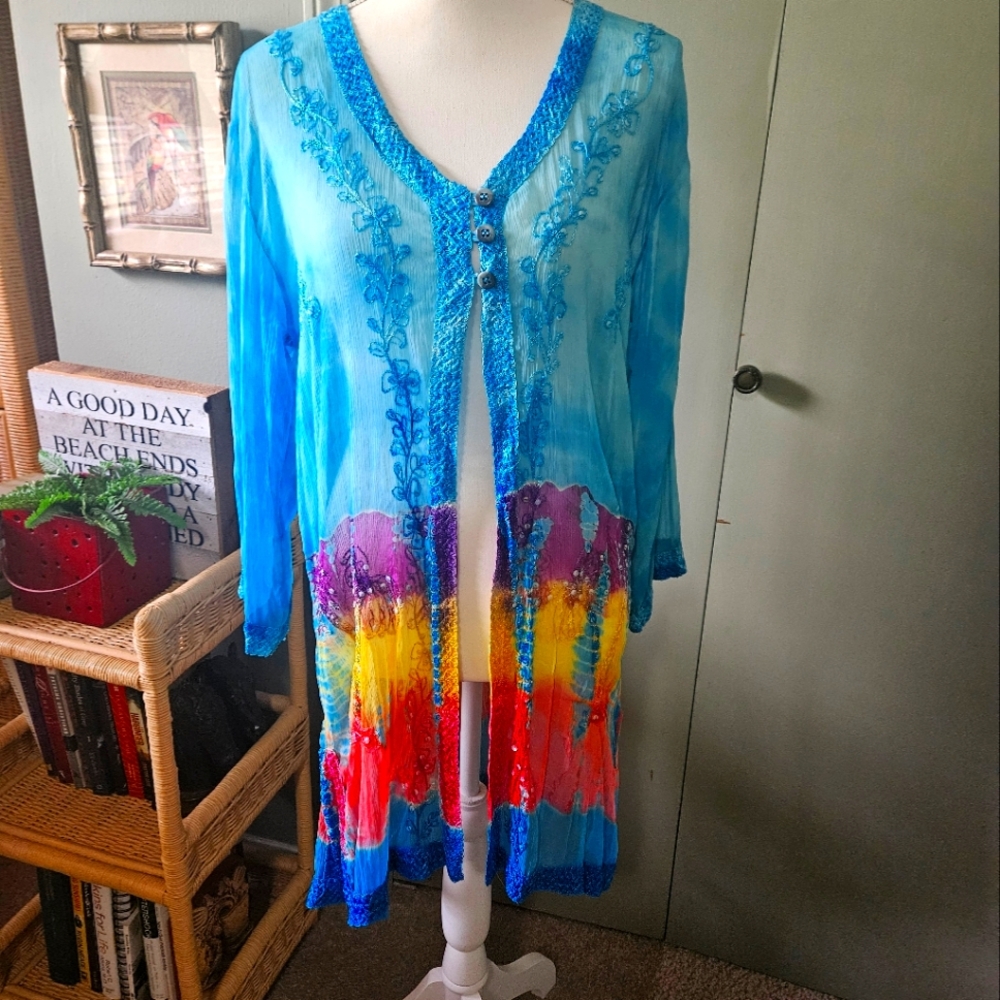 Beach Cover-up one size fits most. Sheer, beautiful colors.